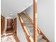 Hallway featuring a hardwood floor, staircase with carpet, and natural light from the front door at 2308 Hearth Dr # 36, Evergreen, CO 80439