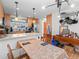 Open-concept kitchen featuring stainless steel appliances, a breakfast bar, and an adjacent dining area at 2308 Hearth Dr # 36, Evergreen, CO 80439