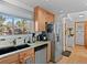 Kitchen featuring stainless steel appliances, light wood cabinets, granite counters, and ample natural light at 2308 Hearth Dr # 36, Evergreen, CO 80439