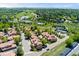 Aerial view of a neighborhood with lush landscaping, community amenities, and well-maintained residential properties at 9117 Nambe Trl, Lone Tree, CO 80124