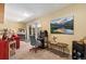 Finished basement area with recreational space, including an arcade machine and comfortable seating at 9117 Nambe Trl, Lone Tree, CO 80124