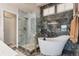 Modern bathroom featuring a soaking tub, glass shower, and elegant finishes for a spa-like experience at 9117 Nambe Trl, Lone Tree, CO 80124