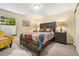Inviting bedroom featuring a well-made bed, side tables, and decorative lamps for a cozy atmosphere at 9117 Nambe Trl, Lone Tree, CO 80124