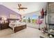 Main bedroom with vaulted ceiling, fireplace and en suite bathroom at 9117 Nambe Trl, Lone Tree, CO 80124