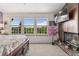 Bedroom with vaulted ceiling, fireplace and views to the outdoors at 9117 Nambe Trl, Lone Tree, CO 80124