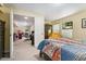Comfortable bedroom offering a spacious closet and natural light with an adjacent door to another room at 9117 Nambe Trl, Lone Tree, CO 80124