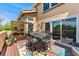 Charming outdoor deck featuring a cozy dining area with beautiful accents and abundant natural light for relaxation at 9117 Nambe Trl, Lone Tree, CO 80124