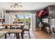 Bright dining area features a fireplace, sliding doors to the balcony, and stylish decor at 9117 Nambe Trl, Lone Tree, CO 80124