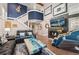 Bright living room with a striking staircase, fireplace, and comfortable seating, perfect for entertaining at 9117 Nambe Trl, Lone Tree, CO 80124
