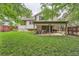 Backyard featuring a lawn and a patio with outdoor seating and a grill at 6443 S Florence Way, Englewood, CO 80111