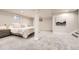 Well-lit main bedroom with soft carpet and lots of room for an additional sitting area at 6443 S Florence Way, Englewood, CO 80111