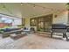 Covered outdoor patio featuring concrete, lounge furniture, and a grill at 6443 S Florence Way, Englewood, CO 80111