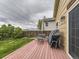 A backyard featuring a well maintained deck with a grill and dining area at 285 N Holcomb St, Castle Rock, CO 80104