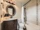 Charming bathroom with updated shower, vanity, bronze fixtures, and decorative tiled trim at 285 N Holcomb St, Castle Rock, CO 80104