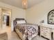 Simple bedroom with carpet floors, white dresser and decorative mirror at 285 N Holcomb St, Castle Rock, CO 80104