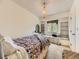 Bedroom with a window seat, built-in shelves, and a woven pendant light above the patterned bed at 285 N Holcomb St, Castle Rock, CO 80104