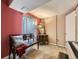 Bedroom featuring red and beige walls, a bench and a keyboard at 285 N Holcomb St, Castle Rock, CO 80104