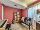 Bedroom featuring red walls, wooden shelving, and a keyboard at 285 N Holcomb St, Castle Rock, CO 80104