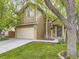 Charming two-story home features a two-car garage and well-maintained front lawn, with lovely curb appeal at 285 N Holcomb St, Castle Rock, CO 80104