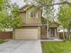 Inviting home with a two-car garage, attractive siding, and a welcoming front entrance, exuding suburban charm at 285 N Holcomb St, Castle Rock, CO 80104