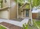 Welcoming front entrance features a decorated door, brick accents, and a well-maintained walkway leading to the home at 285 N Holcomb St, Castle Rock, CO 80104