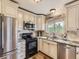 Well-equipped kitchen with stainless steel appliances, stylish backsplash, and plenty of natural light at 285 N Holcomb St, Castle Rock, CO 80104