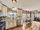 Bright, open kitchen area seamlessly connects to the dining space, creating a perfect hub for entertaining at 285 N Holcomb St, Castle Rock, CO 80104