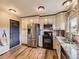 Modern kitchen boasts stainless steel appliances, granite countertops, and ample cabinet space, perfect for culinary enthusiasts at 285 N Holcomb St, Castle Rock, CO 80104