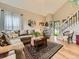 Cozy living room features vaulted ceilings, a decorative rug, and ample seating space, perfect for relaxation at 285 N Holcomb St, Castle Rock, CO 80104