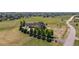 Aerial view of a well-maintained acreage with mature landscaping and a circle driveway at 3048 Deer Creek Ranch Loop, Parker, CO 80138