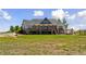 A gorgeous house with an outdoor wooden deck, a meticulously maintained lawn and outdoor seating at 3048 Deer Creek Ranch Loop, Parker, CO 80138