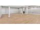 Spacious basement with light hardwood floors and neutral colored walls ready for finishing at 3048 Deer Creek Ranch Loop, Parker, CO 80138