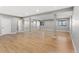 Unfinished basement with light hardwood floors, columns, and neutral colored walls and trim at 3048 Deer Creek Ranch Loop, Parker, CO 80138