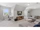 Bright bonus room with gray walls, plush carpet, television, desk, and comfortable couch area at 3048 Deer Creek Ranch Loop, Parker, CO 80138