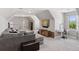 Comfortable bonus room with gray walls, plush carpet, modern desk, entertainment center and large couch at 3048 Deer Creek Ranch Loop, Parker, CO 80138