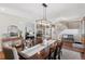 Open-concept dining room with a view of the Gathering room and a staircase at 3048 Deer Creek Ranch Loop, Parker, CO 80138