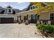 Charming home with large porch, rocking chairs, flower pots and spacious three car garage at 3048 Deer Creek Ranch Loop, Parker, CO 80138