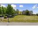 Beautiful home with large front yard, well manicured lawn, and mature shade trees at 3048 Deer Creek Ranch Loop, Parker, CO 80138
