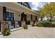 Inviting front porch featuring stylish pillars, flower pots, and comfortable seating at 3048 Deer Creek Ranch Loop, Parker, CO 80138