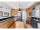 Gourmet kitchen boasts custom cabinetry, granite counters, and stainless steel appliances at 3048 Deer Creek Ranch Loop, Parker, CO 80138