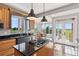 Well-appointed kitchen features granite countertops, stainless steel appliances, and a center island at 3048 Deer Creek Ranch Loop, Parker, CO 80138