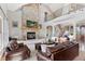 Warm and inviting living room featuring a stone fireplace and comfortable seating at 3048 Deer Creek Ranch Loop, Parker, CO 80138