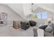 Upstairs loft seating area with vaulted ceilings, plush seating, and natural lighting from a window at 3048 Deer Creek Ranch Loop, Parker, CO 80138