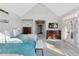 Luxurious main bedroom featuring a comfortable sitting area and stylish furnishings at 3048 Deer Creek Ranch Loop, Parker, CO 80138