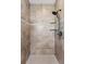 Tiled shower with large gray tiles, mosaic tile accent, and black shower hardware at 3048 Deer Creek Ranch Loop, Parker, CO 80138