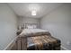 Charming bedroom featuring a rustic wooden bed frame and a vintage trunk at 2293 S Oswego Way, Aurora, CO 80014