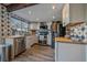 Modern kitchen with stainless steel appliances and wood countertops at 2293 S Oswego Way, Aurora, CO 80014