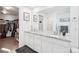 Main bathroom with double vanity and large walk-in shower at 8373 Rush Creek Ave, Littleton, CO 80125