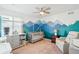 Bedroom with mountain mural, crib, and recliner at 8373 Rush Creek Ave, Littleton, CO 80125