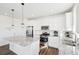 Bright kitchen with white cabinets, granite countertops, and stainless steel appliances at 8373 Rush Creek Ave, Littleton, CO 80125